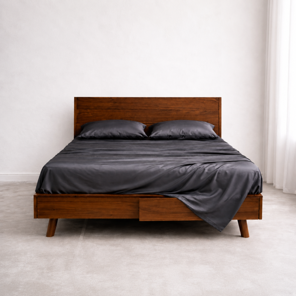 Luxury king size bed with breathable eucalyptus bedding in dark grey for cool and dry sleep comfort.
