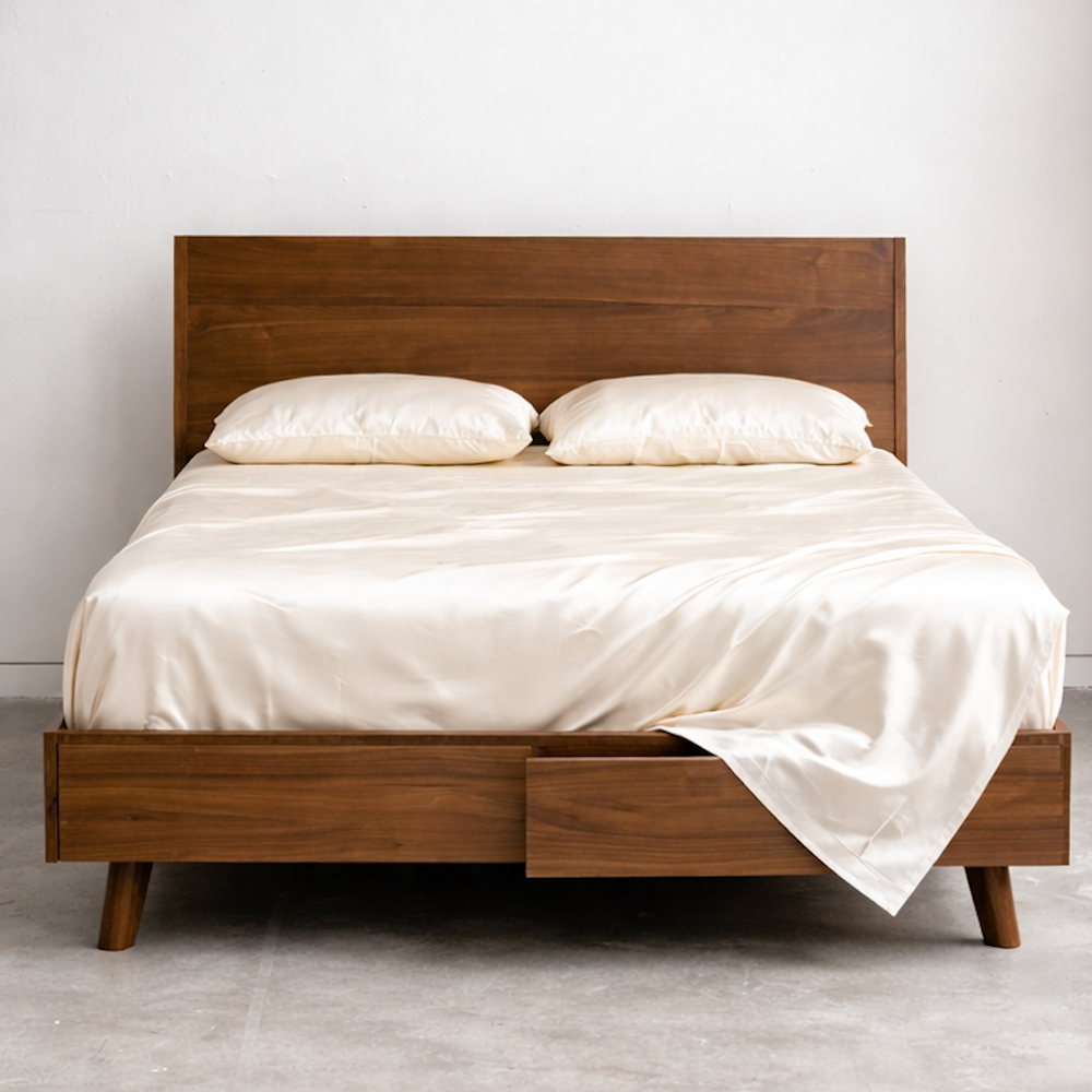 Luxury king size bed with breathable eucalyptus bedding in white ivory for cool and dry sleep comfort.