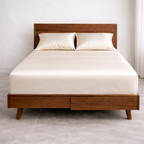 Luxury king size bed with breathable fitted eucalyptus sheet in white ivory for cool and dry sleep comfort.
