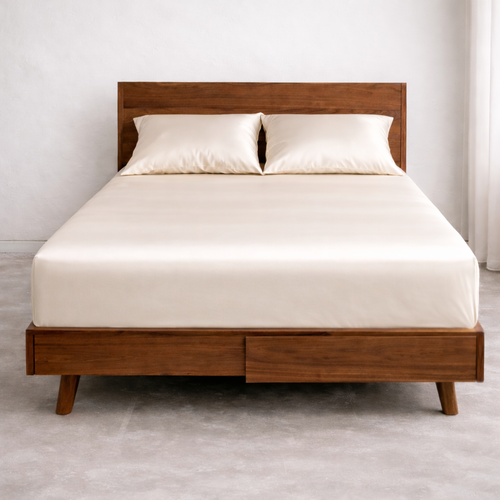 Luxury king size bed with breathable fitted eucalyptus sheet in white ivory for cool and dry sleep comfort.