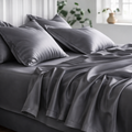 Dark grey cooling eucalyptus flat sheets designed for hot sleepers and menopausal women experiencing night sweats.