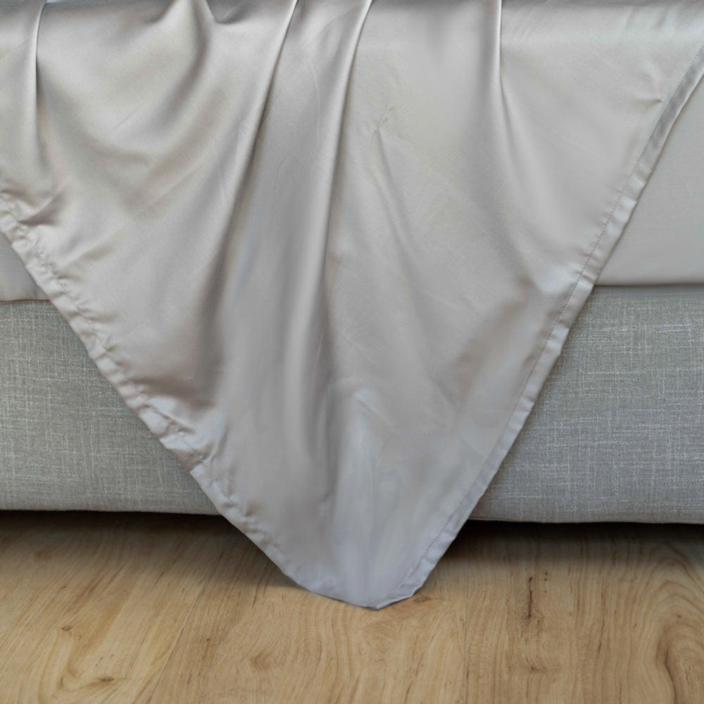 Silky-soft light grey eucalyptus sheets with breathable cooling comfort for menopause and warm nights.